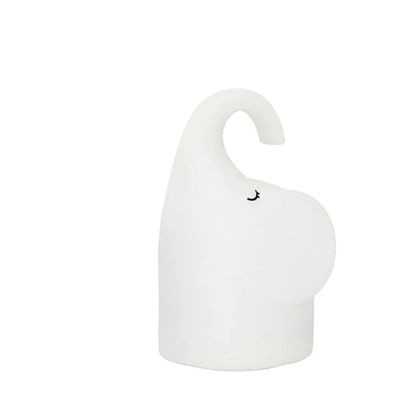 DOMI Elephant shaped night light with soft silicone body and warm white LED glow.