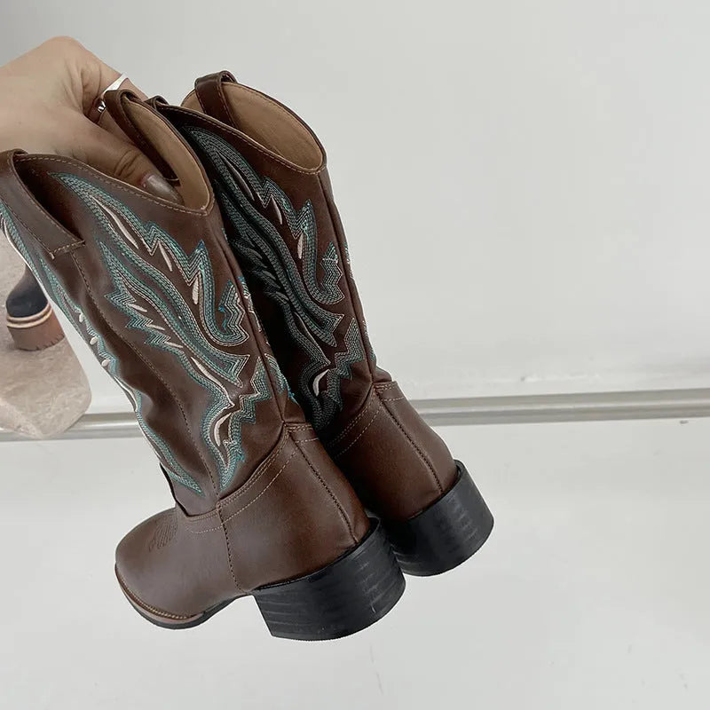 Brown embroidered women's mid-calf Martin boots with a square heel on a white background.