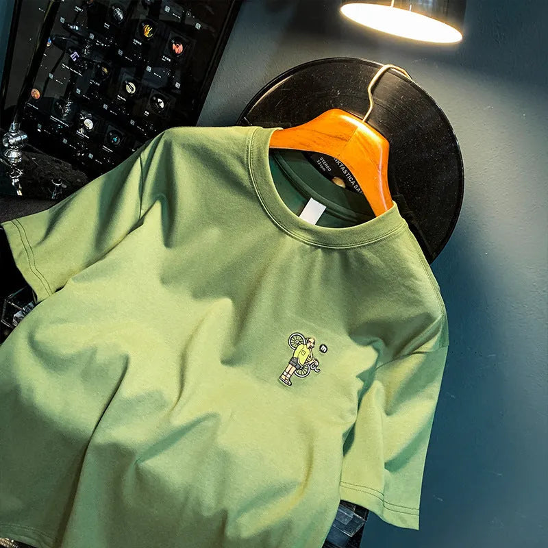 Green men's loose t-shirt with a literary graphic print on the front, short sleeves.