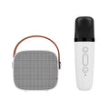 Compact blue, pink or white portable Bluetooth speaker with built-in microphone on a surface.