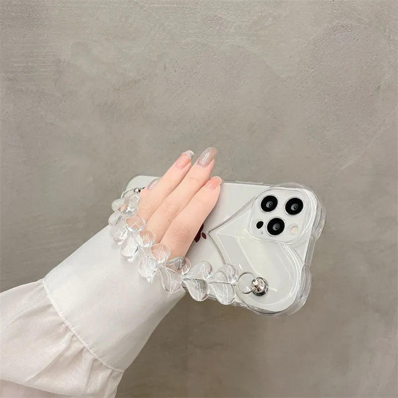 Transparent clear iPhone case with a love heart chain design on a smartphone.