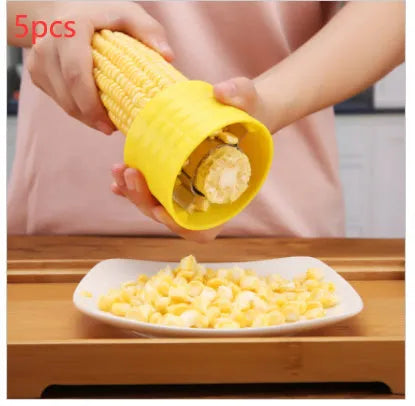 Yellow corn-shaped manual thresher with stainless steel gear for removing kernels from corn cobs