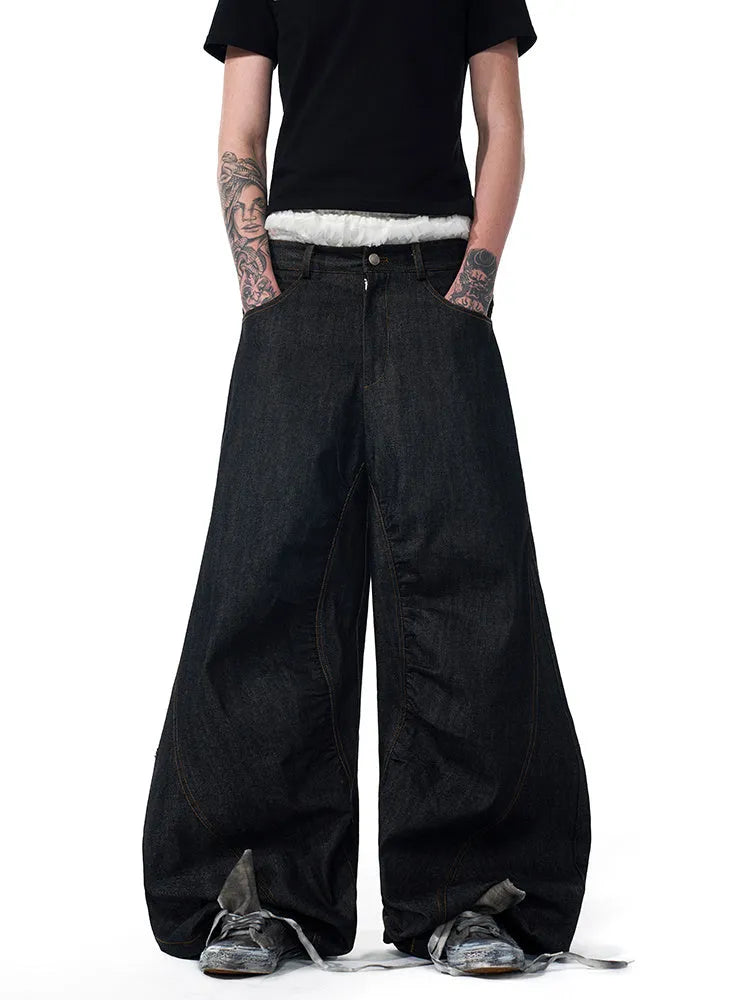 Black wide leg jeans with colour-changing temperature-sensitive embroidery and red ear detailing on a hanger.