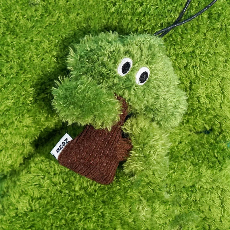 Pine tree shaped hanging cat toy with textured surface and bag of catnip.