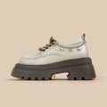 White women's platform Mary Jane shoes with round toe, front lace-up, and a chunky heel