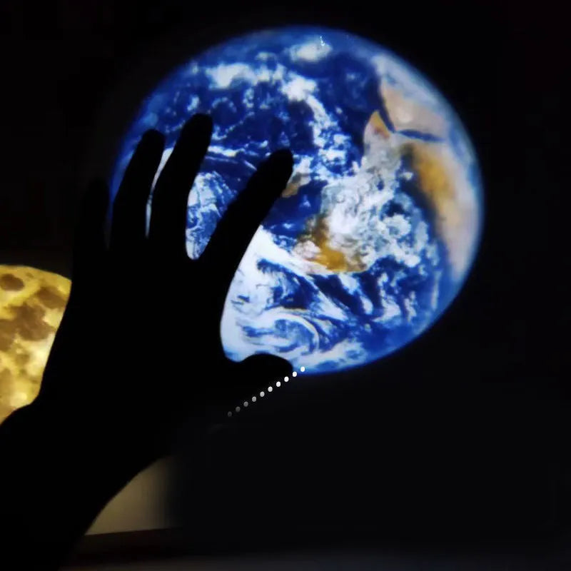 2 in 1 Earth and Moon star projector lamp with adjustable hose bracket on a table