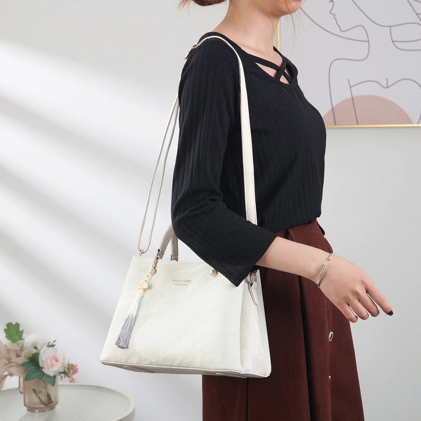 Women's square shoulder bag in PU leather with ethnic detailing and slit pocket