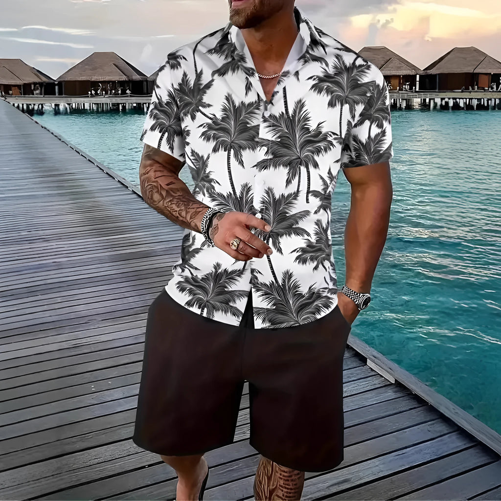 Man wearing a blue Hawaii-themed 3D printed short sleeve shirt and matching shorts.