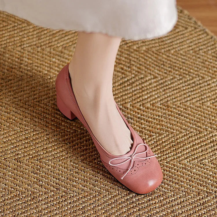 Women's round toe mid heel chunky leather pumps in solid colour with bow detail