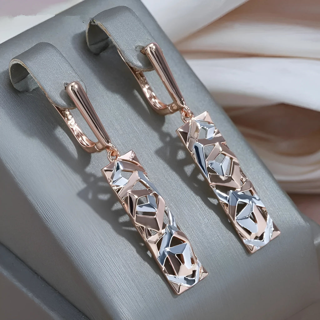 Rectangular two-tone hollow alloy stud earrings for women with electroplated finish.