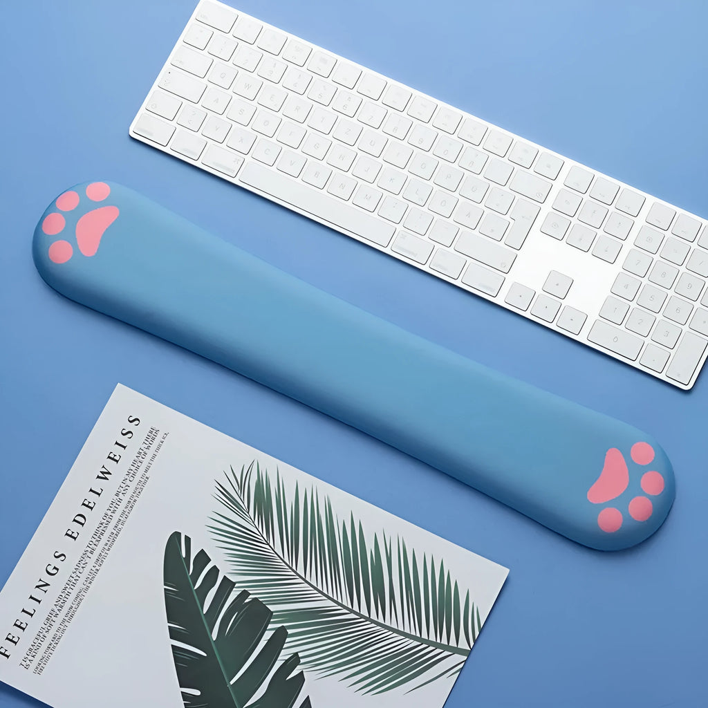 Cat's claw cartoon design memory foam keyboard wrist rest in blue on a desk