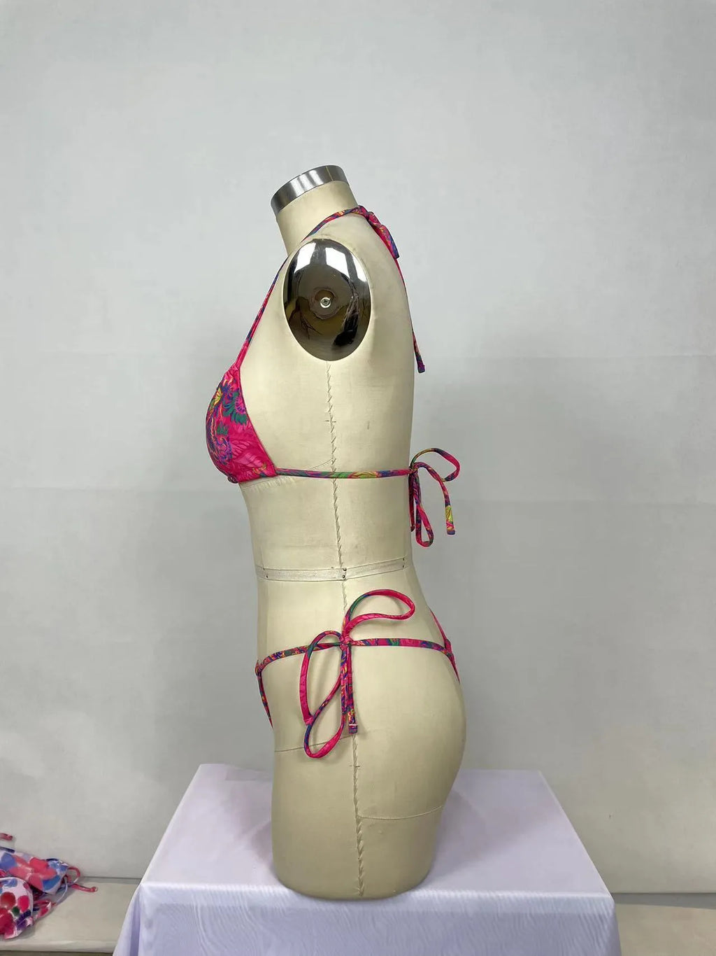 Women's pink printed nylon bikini two-piece set showing front and back views