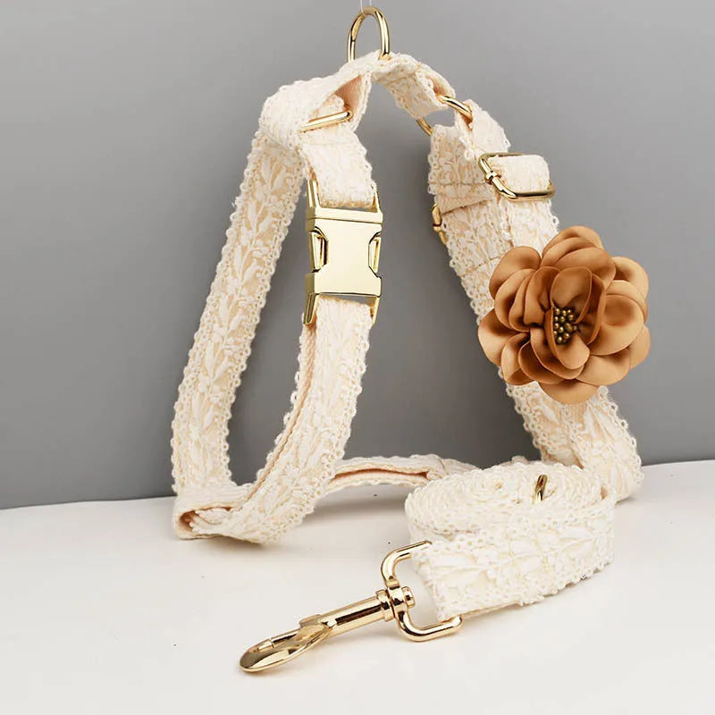 Four-piece dog wedding set with lace vest, matching collar, flower headband, and leash on white background