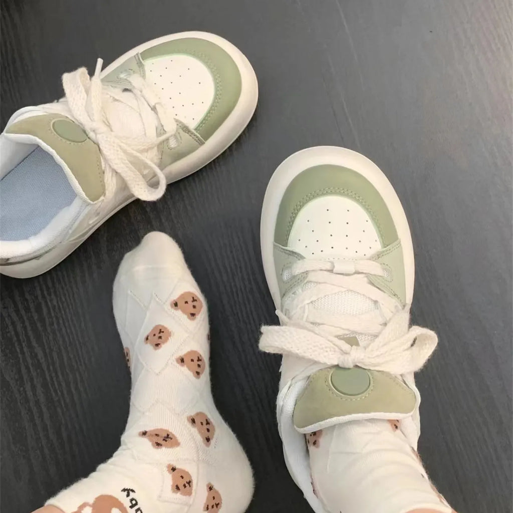 Green women's casual shoes with flat heel and round toe design showing pu mesh upper material