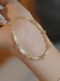 Women's bamboo design bracelet with 6mm Hetian jade beads in either jade or South Red colour.