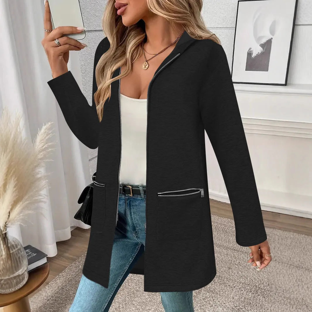 A loose grey mid-length cardigan coat for women with pockets, shown on a hanger.