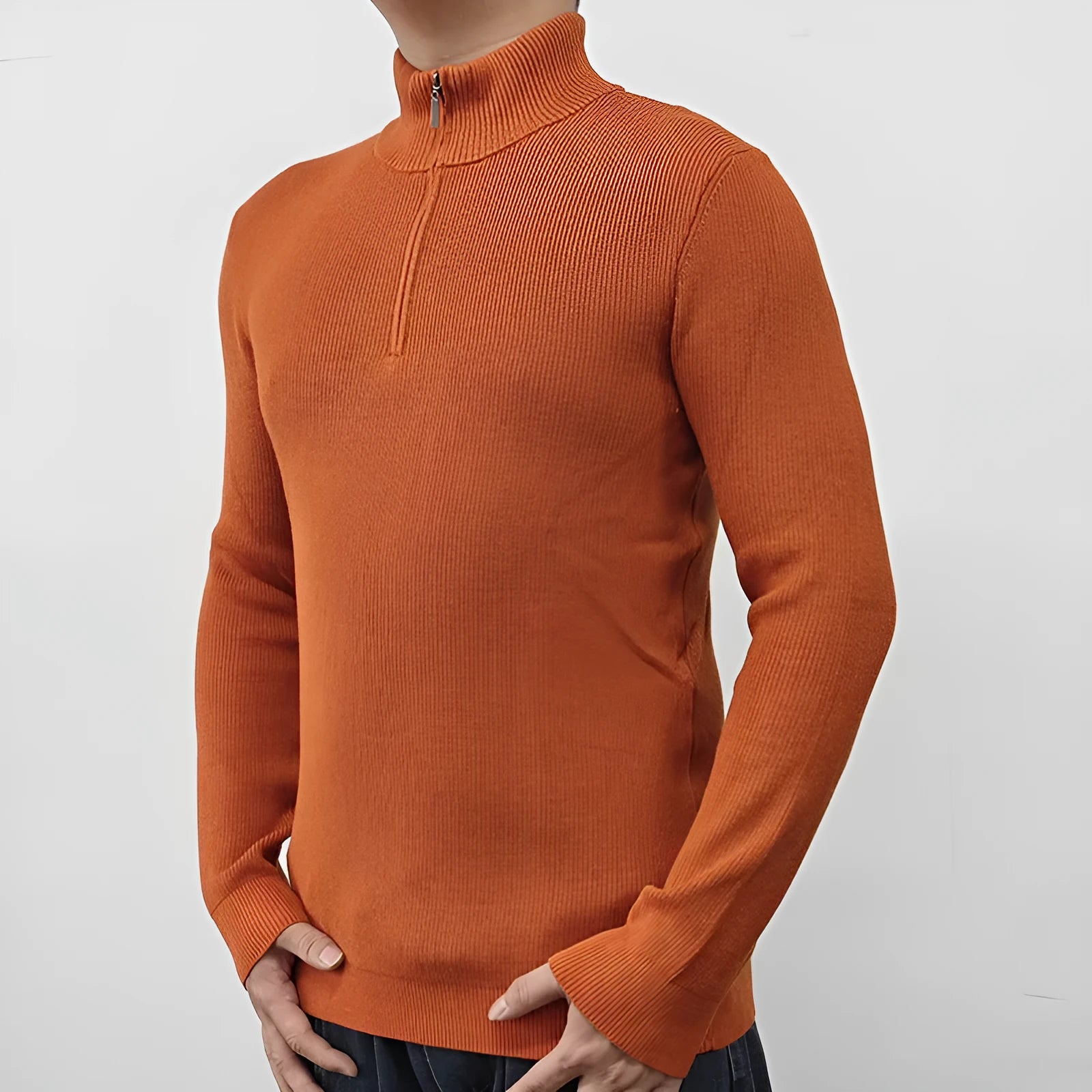 Men's black half-turtleneck zip sweater on a hanger, showing long sleeves and zip front detail.