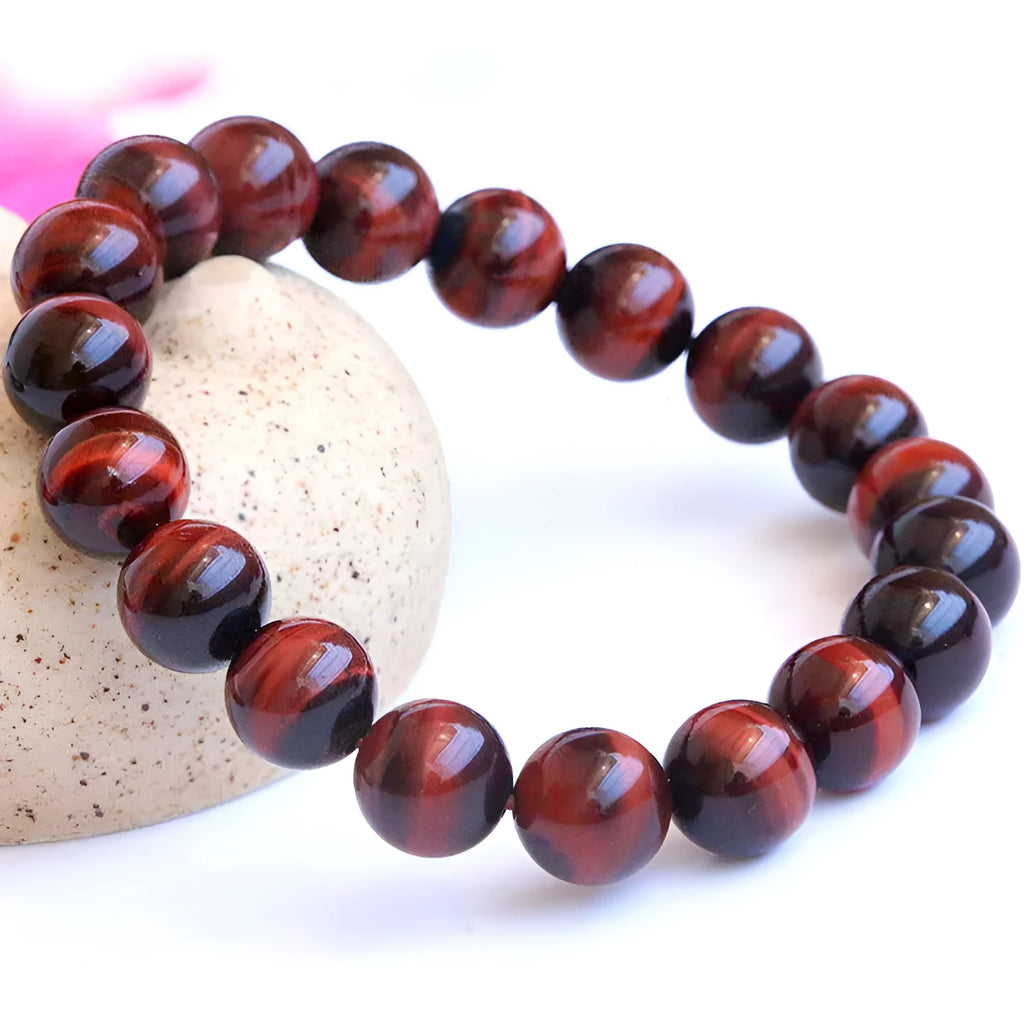 Red tigereye wooden bracelet with geometric bead design showing lightning eye reserva colour stone details