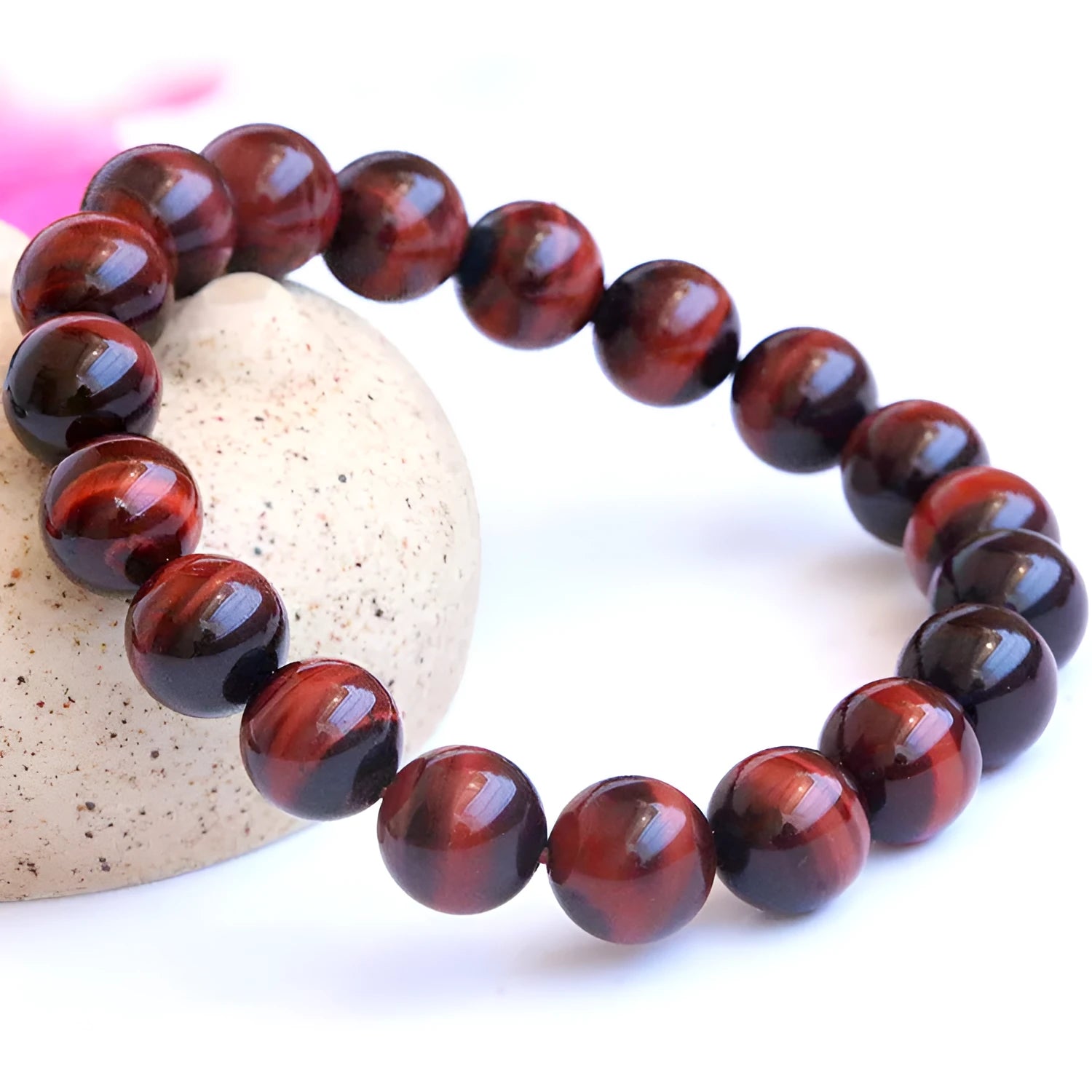 Red tigereye wooden bracelet with geometric bead design showing lightning eye reserva colour stone details