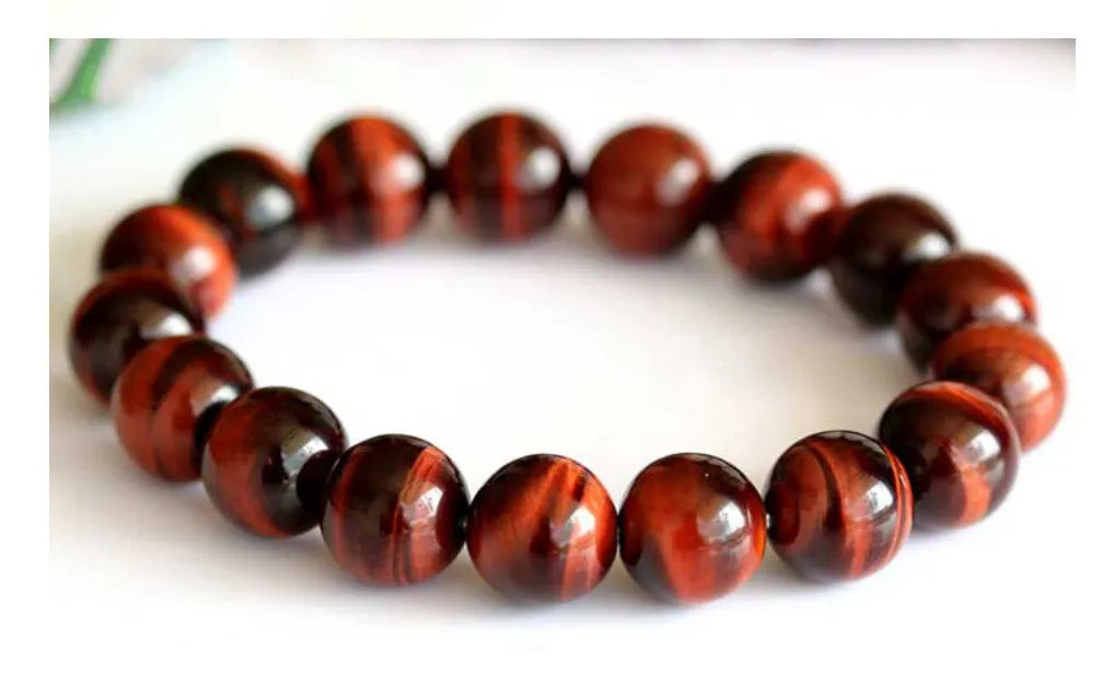 Red tigereye wooden bracelet with geometric bead design showing lightning eye reserva colour stone details