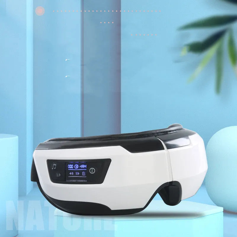 Black and white eye massager with PU leather surface and USB cable for eye care