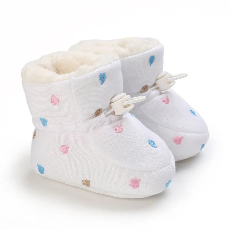Baby autumn winter cotton shoes with tall crown, elastic band, non-slip sole, in black and white, dark blue, gray, or pink.