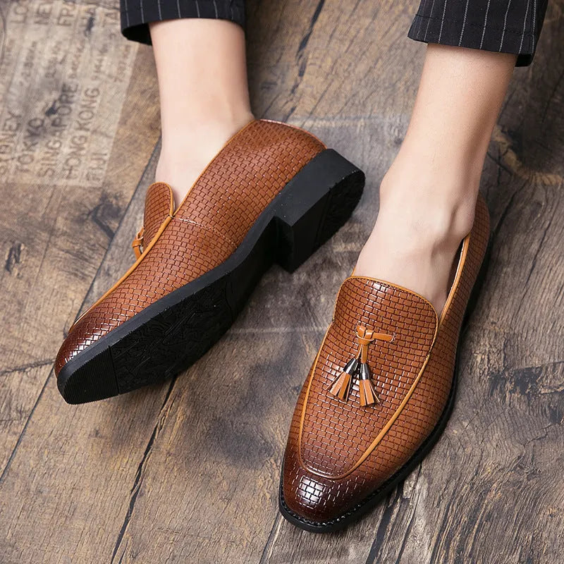 Men's black formal slip-on shoe with pointed toe and decorative tassel on artificial PU upper.