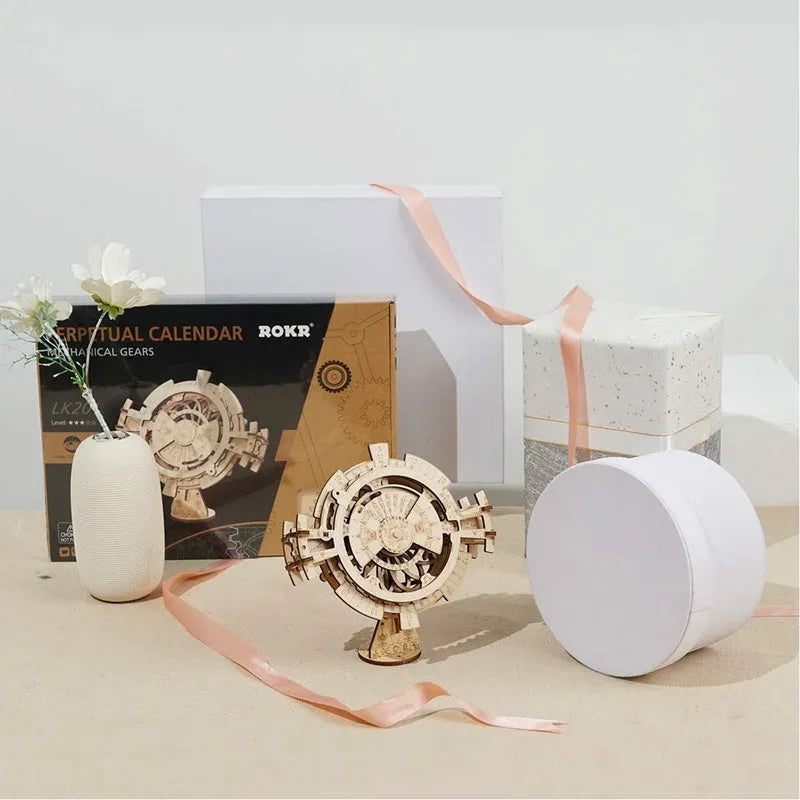 Wooden three-dimensional puzzle film projector with hand crank and gear wheel assembly