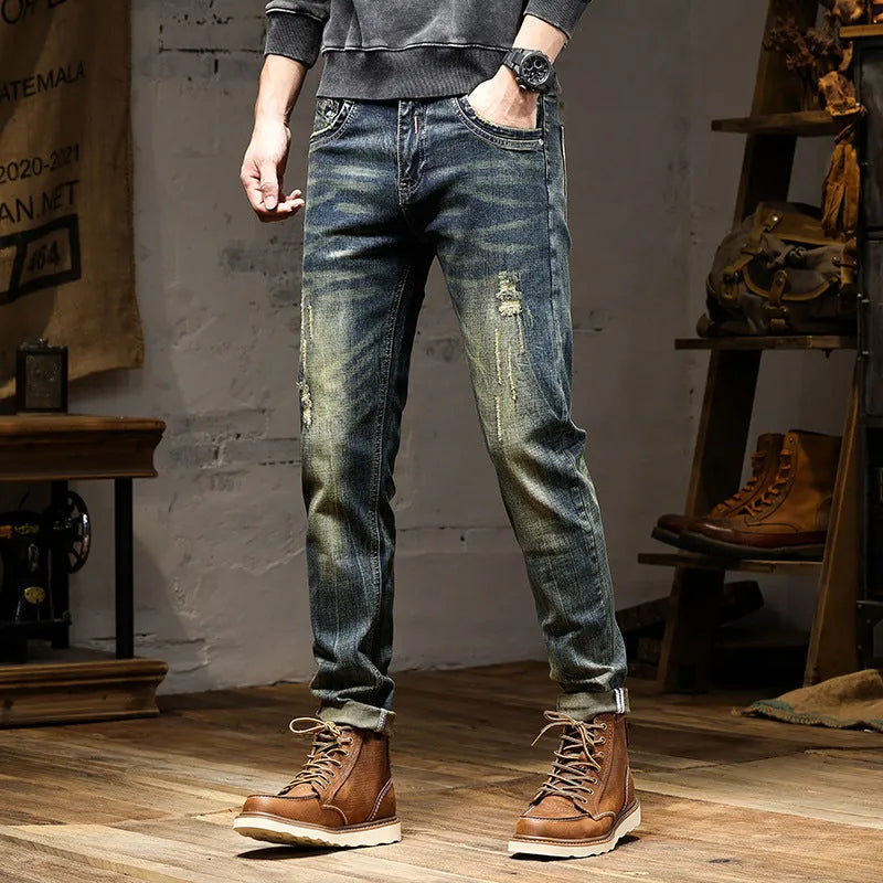 Men's skinny fit stretch jeans in a retro colour, showing zip fly and cotton denim fabric.