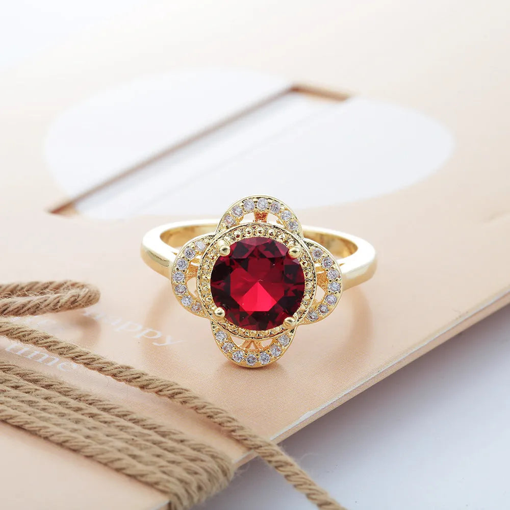 Copper zircon ring with a fruit-shaped design, shown in colour 10-6-1395.