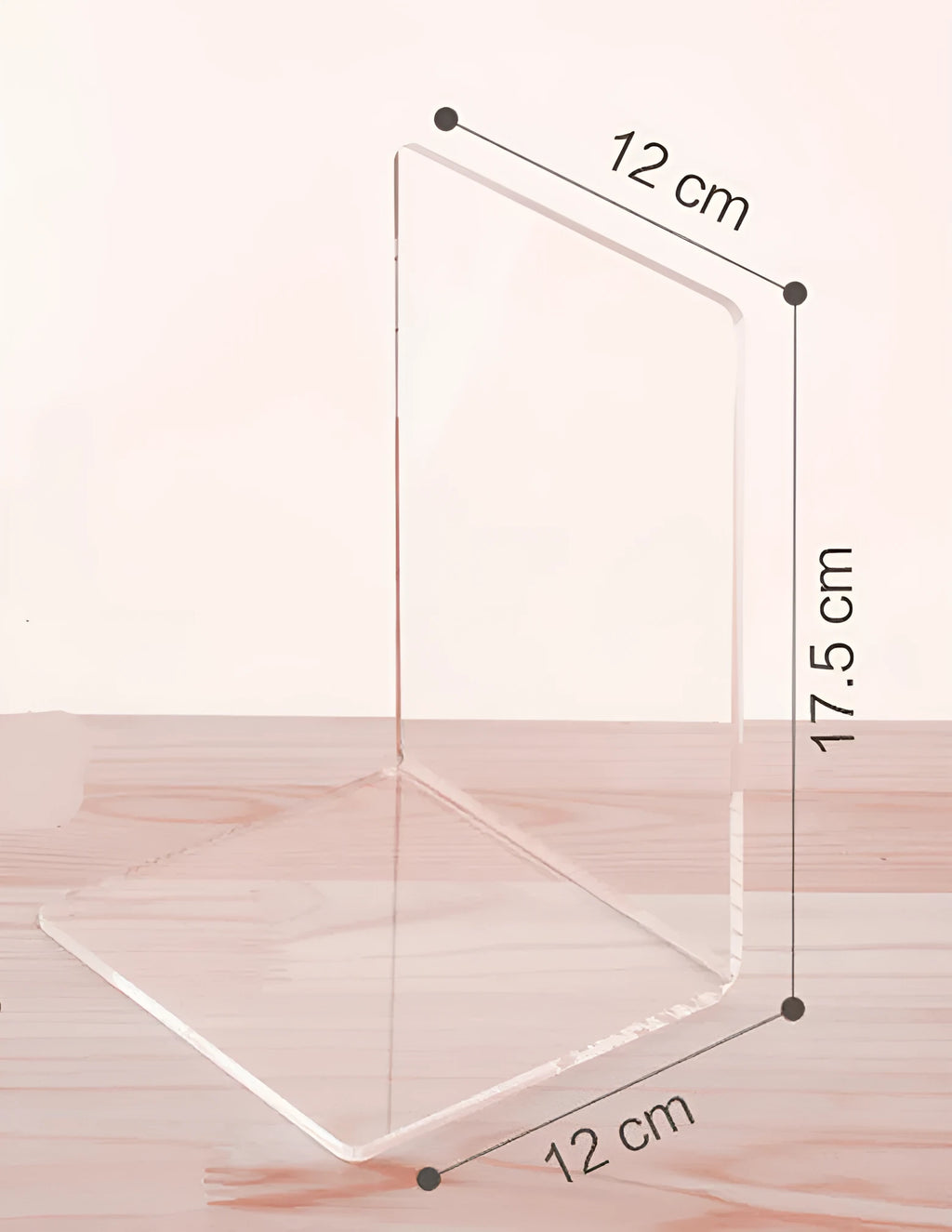 Transparent acrylic bookshelf displaying two books on a desk