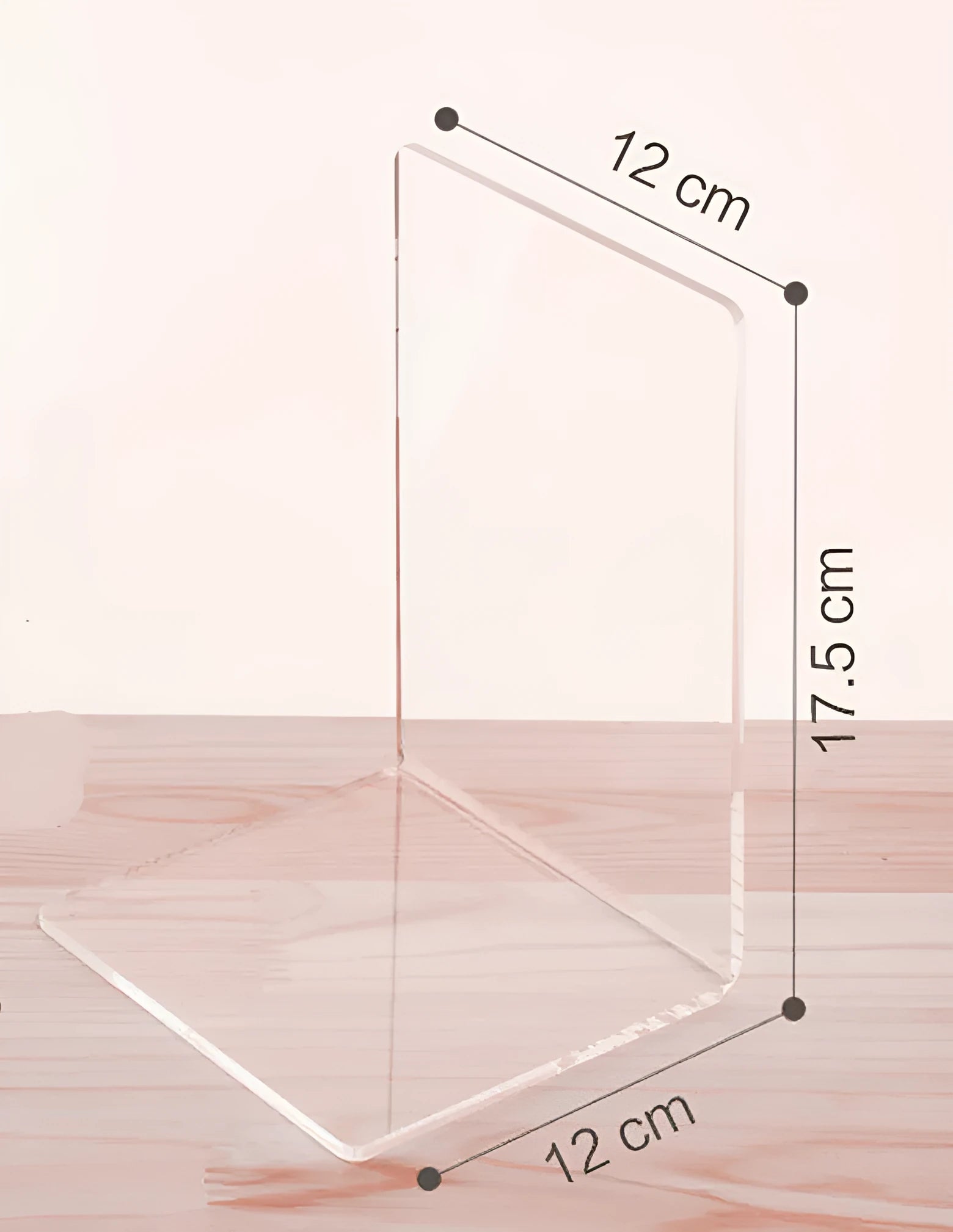 Transparent acrylic bookshelf displaying two books on a desk