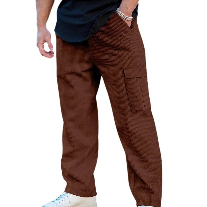 Men's navy blue corduroy wide-leg cargo trousers with a drawstring waist on a neutral background.