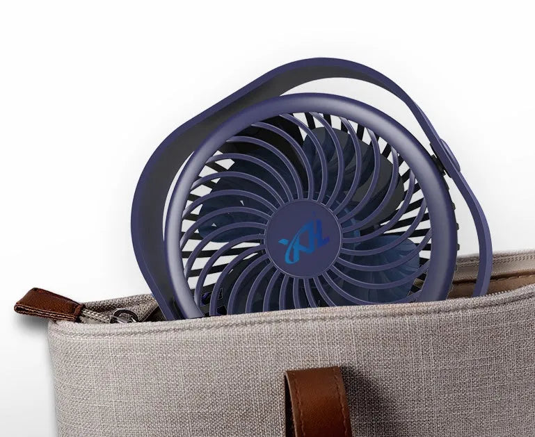 A small, modern USB desk fan in blue with a rotating head on a white desk.