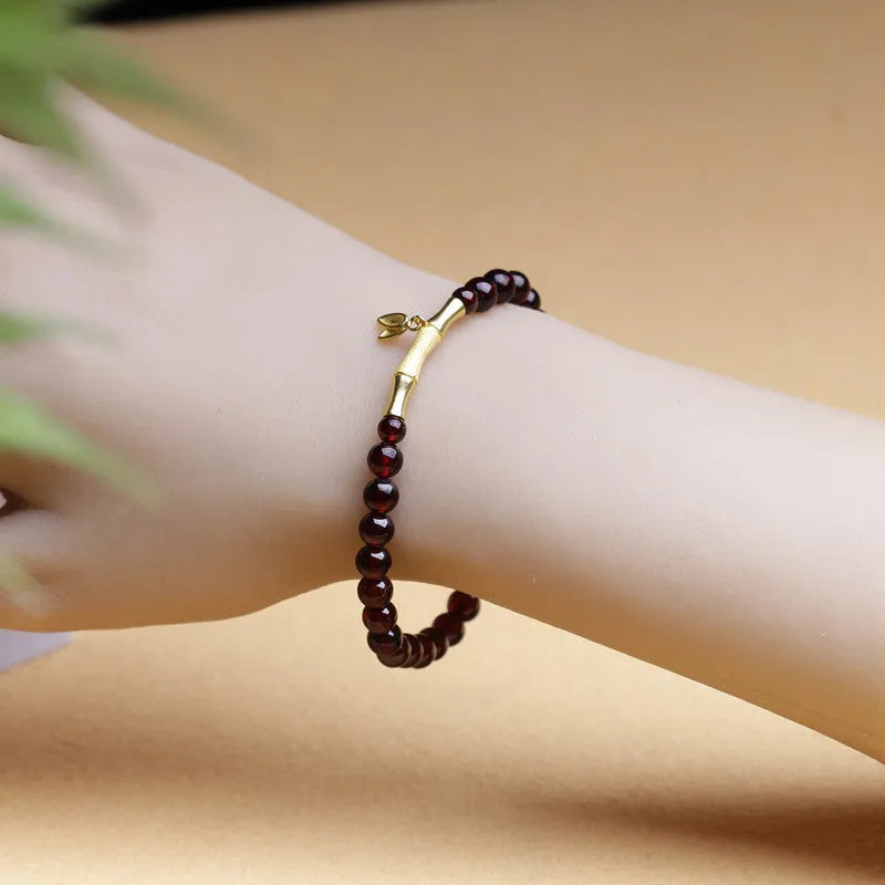 Single ring bamboo joint bracelet with 6mm natural garnet bead in copper or silver finish