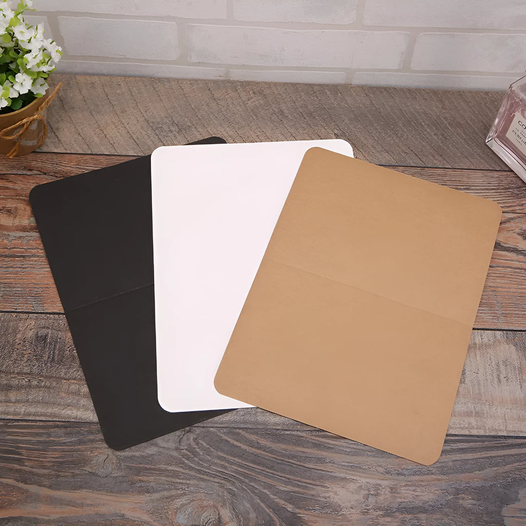 A pack of 100 blank folded kraft paper cards in 10x15cm size, shown in black, brown, and white colours.