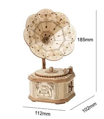 Assembled wooden 3D puzzle model of a Pumpkin Carriage on a white surface, laser-cut plywood construction