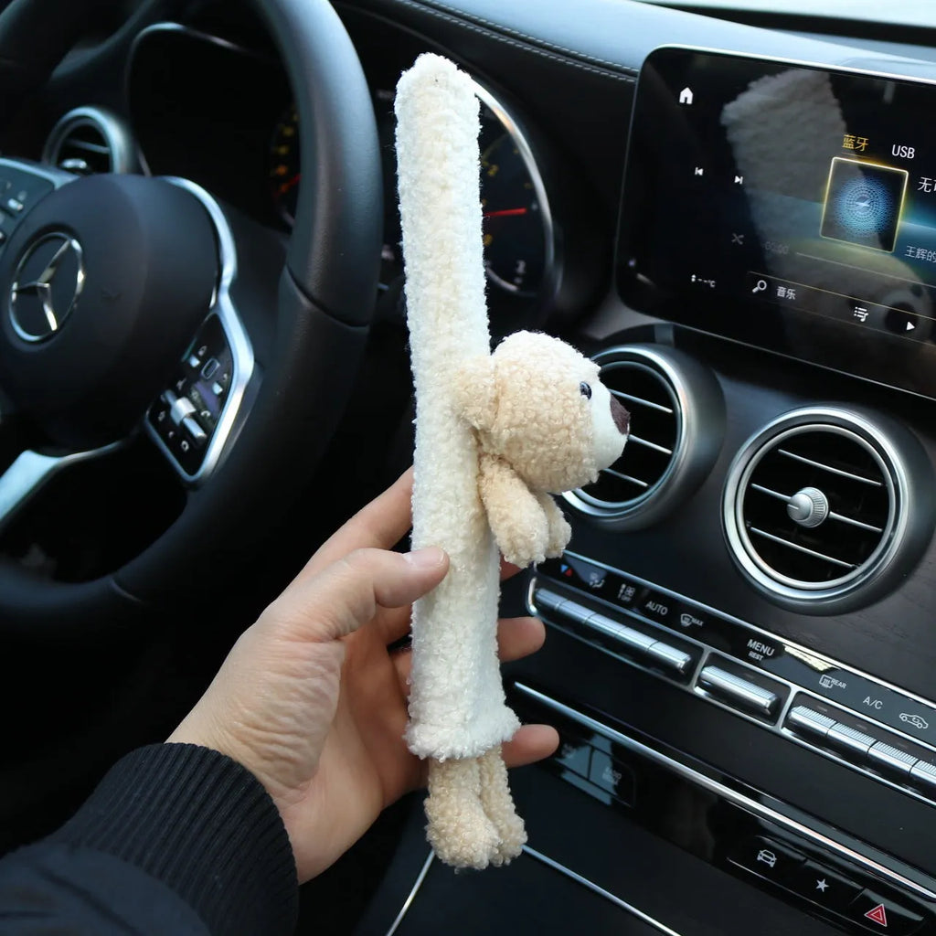 Cartoon rabbit and bear designs on a soft lamb wool car seatbelt shoulder protector.