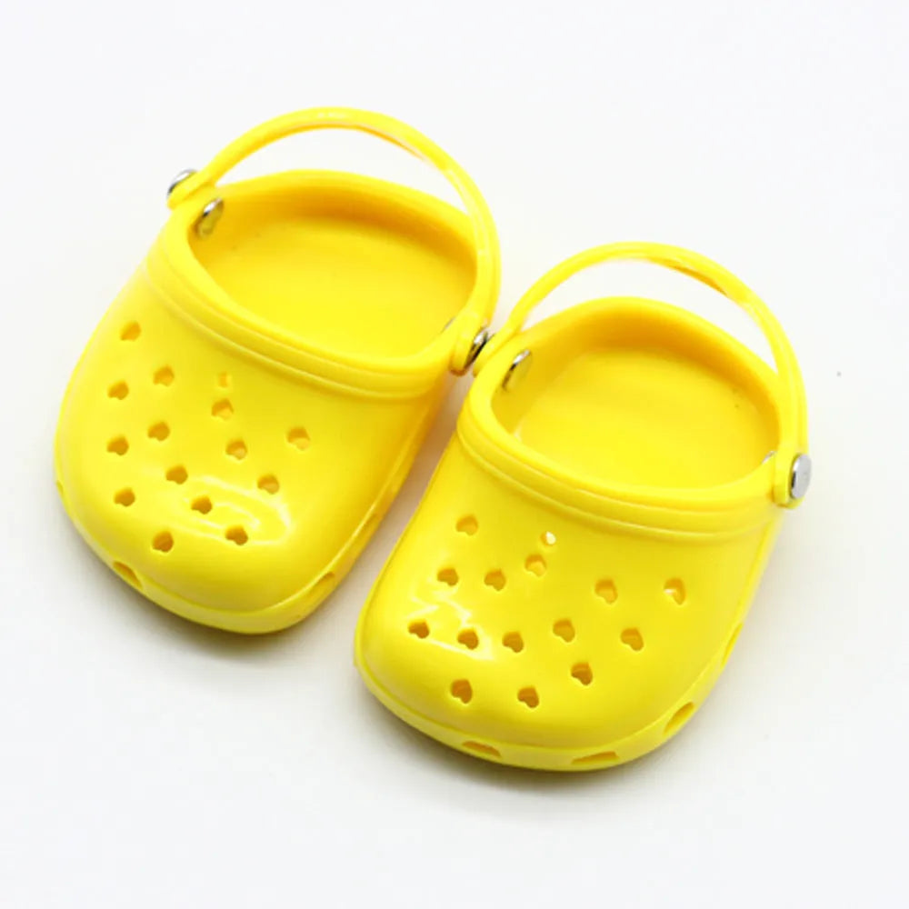 Plastic doll beach slippers accessory in blue, red, yellow, and green colours for fashion dolls