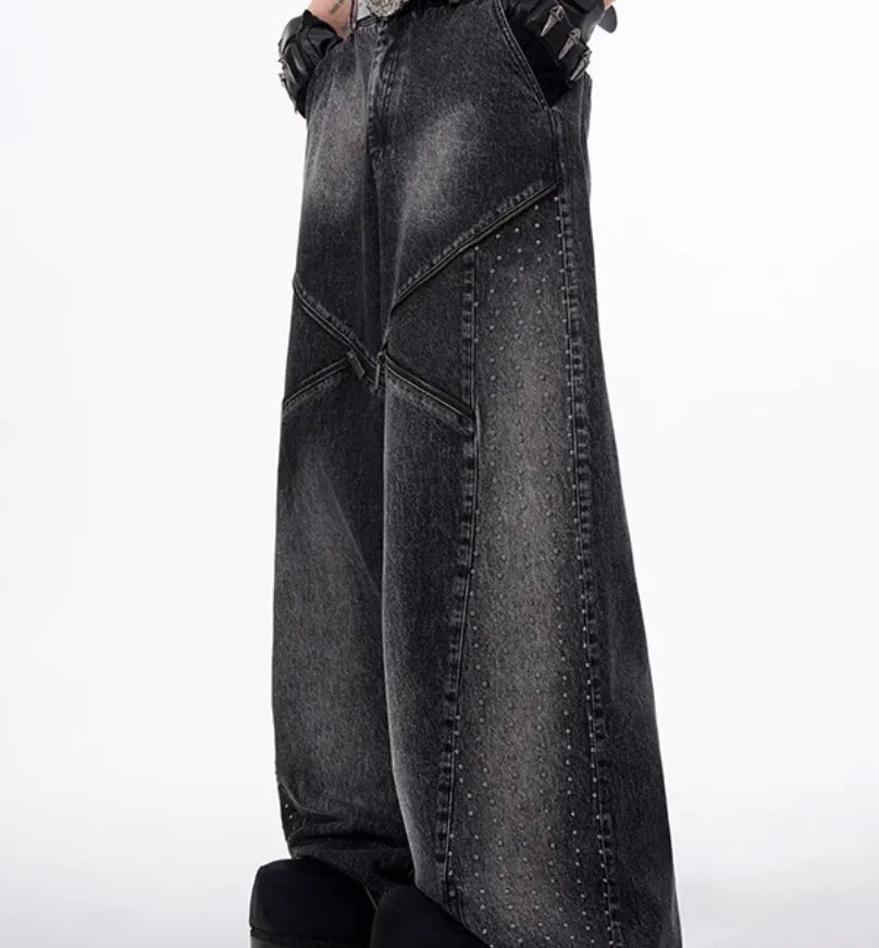 Black and grey washed denim wide leg trousers and vest set on a hanger