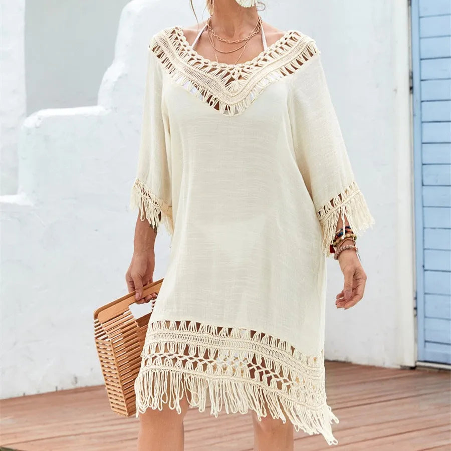 Apricot-coloured crochet patchwork beach dress with half sleeves on a model
