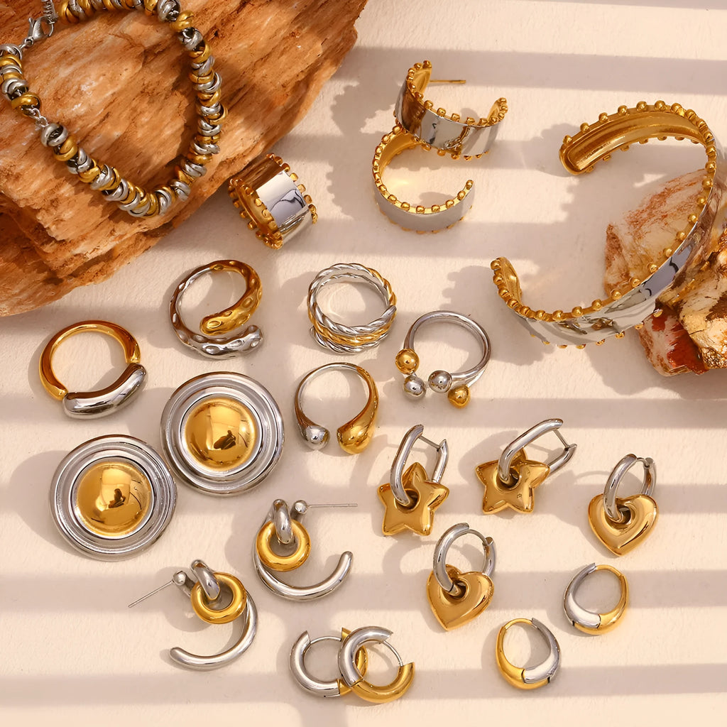 Gold electroplated geometric jewellery set for women with earrings, necklace, and bracelet.