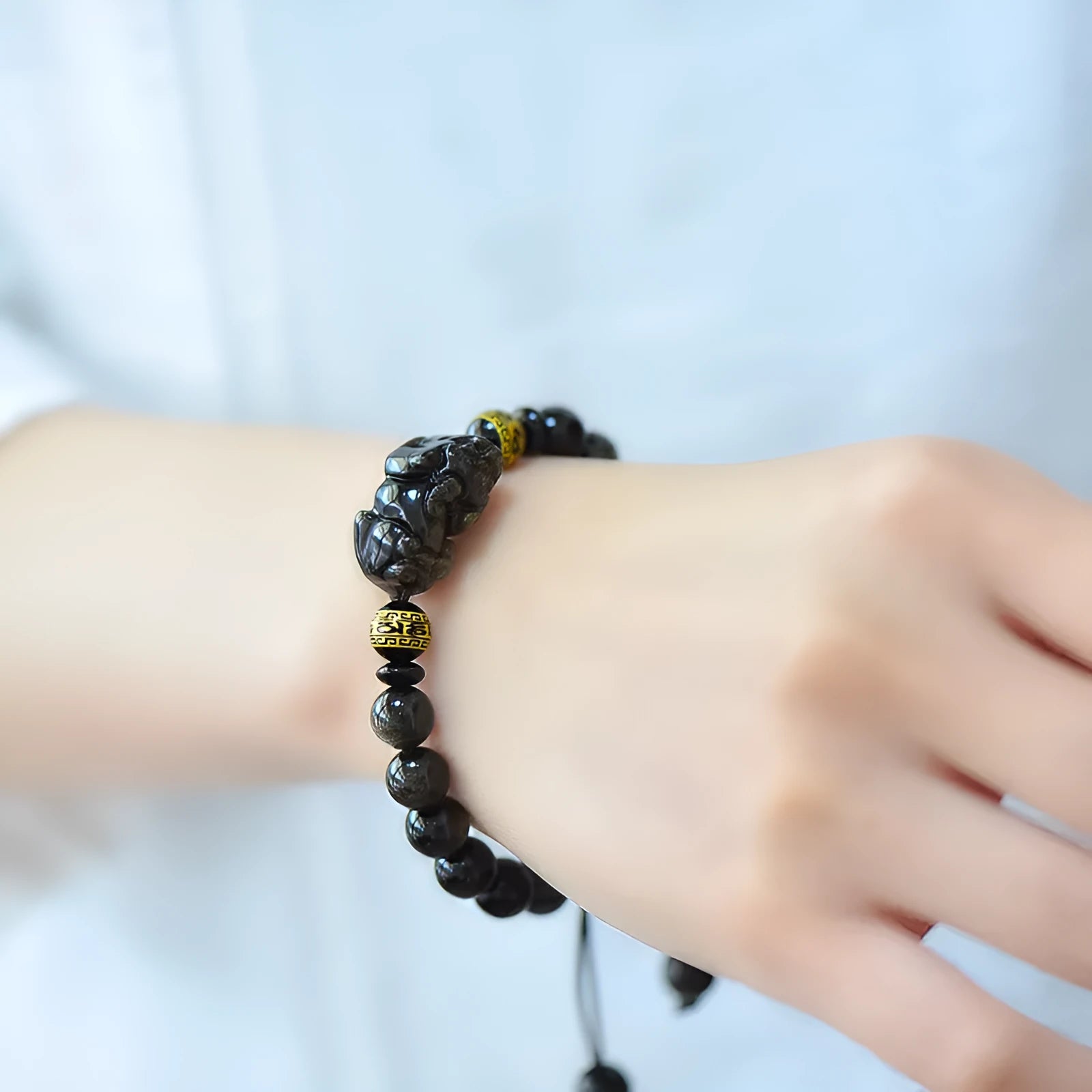 Hand-woven golden obsidian Pi Xiu bracelet with zodiac animal design in Chinese style