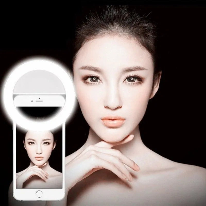 Green clip-on selfie ring light attached to mobile phone showing LED bulbs around camera