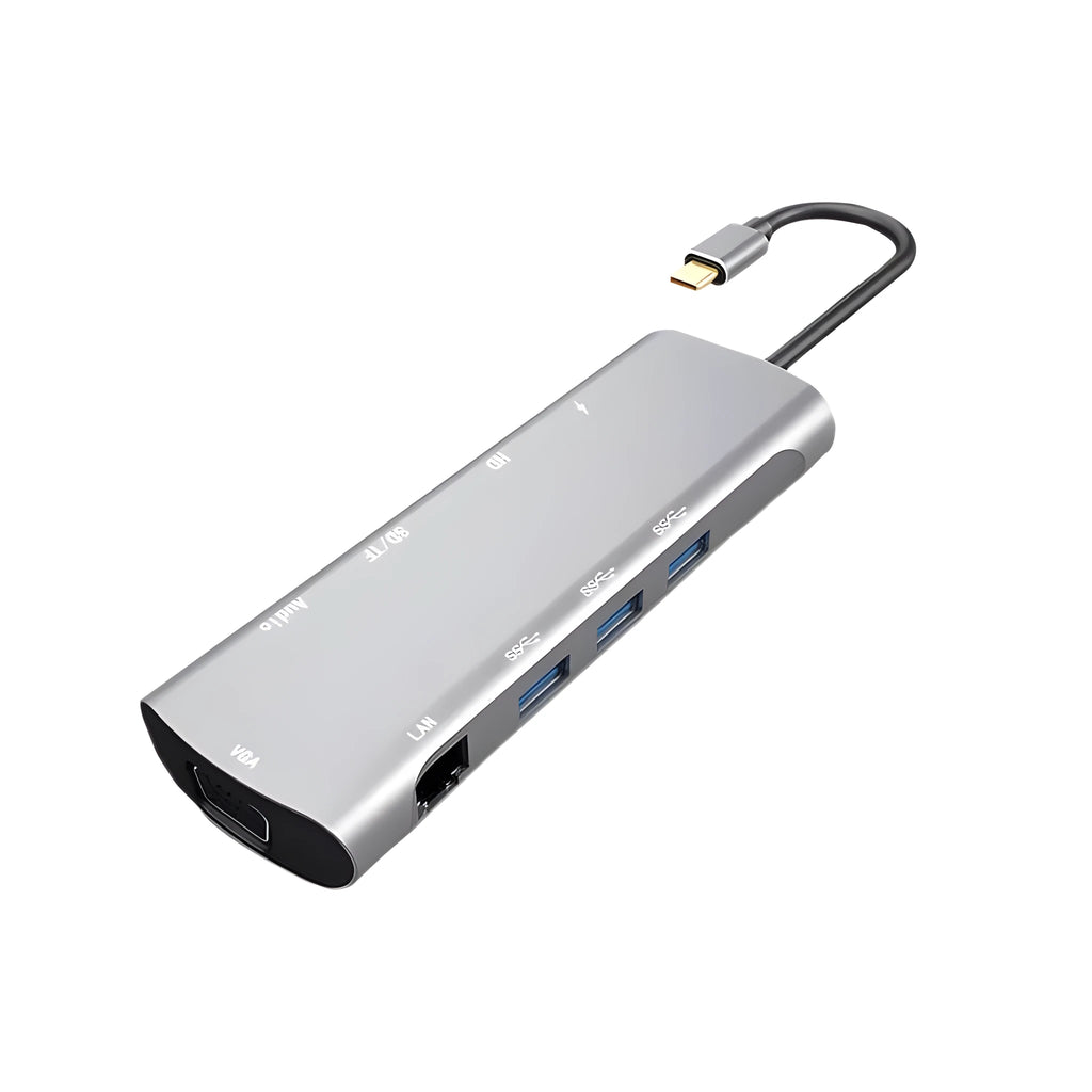 Grey aluminium USB-C docking station with HDMI, VGA, and USB ports on a desk.