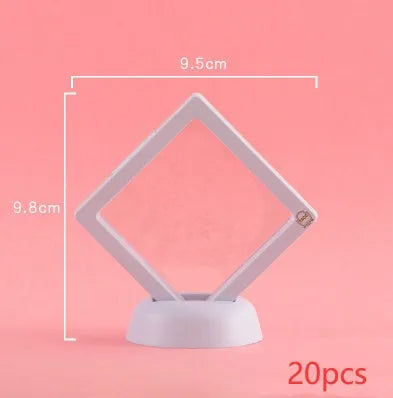 3D floating display case holding coins and jewellery between transparent membrane sheets