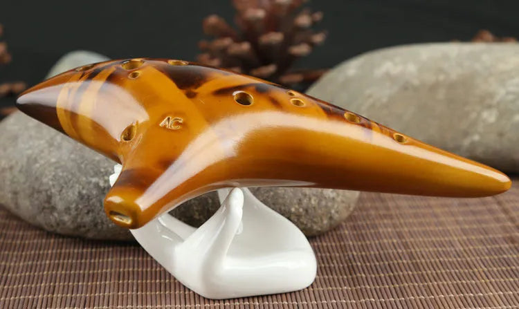 Yellow 12-hole ceramic ocarina in Alto C with 13-note C major range, integrated lanyard, bag and cable