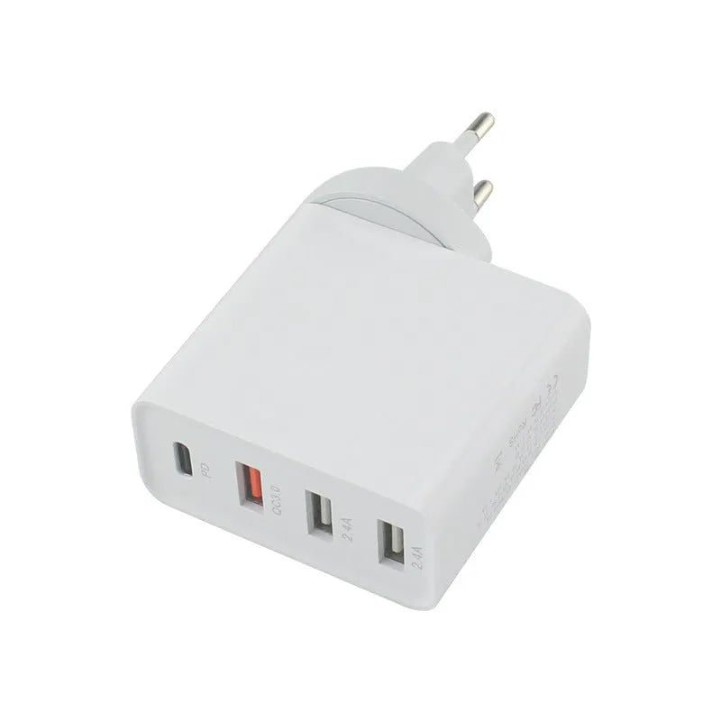 Black and white four-port USB-C wall charger with UK, US, EU, and AU plug options.
