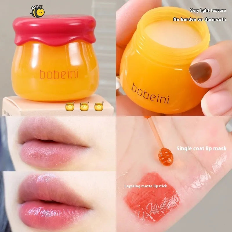 Vaseline lip balm pot in pomegranate or blueberry flavour with small application brush