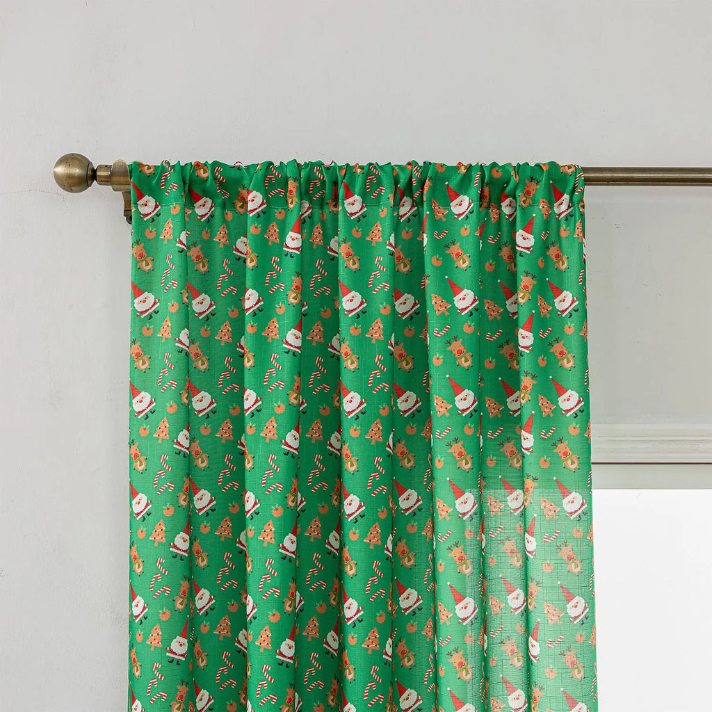 Green Christmas curtain with printed cartoon snowmen and angels, American style.